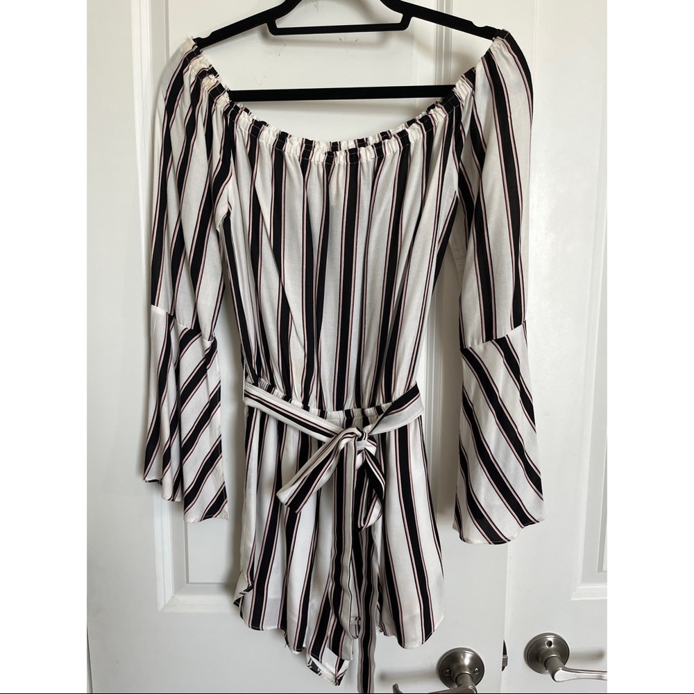 Striped romper with bell sleeves. Comes with matching belt.
